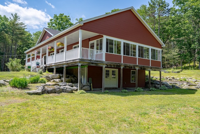 172 Hoxie Hill Rd, Orrington, ME 04474 - rear view of property with a lawn and a deck