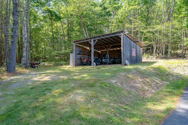 172 Hoxie Hill Rd, Orrington, ME 04474 - view of pole building featuring a wooded view and a carport