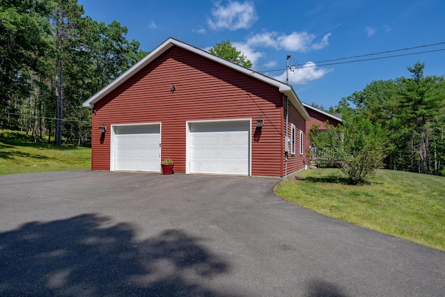 172 Hoxie Hill Rd, Orrington, ME 04474 - view of home's exterior featuring a yard and a detached garage