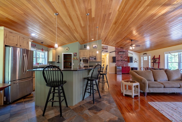 172 Hoxie Hill Rd, Orrington, ME 04474 - kitchen with appliances with stainless steel finishes, lofted ceiling, wooden ceiling, dark countertops, and open floor plan
