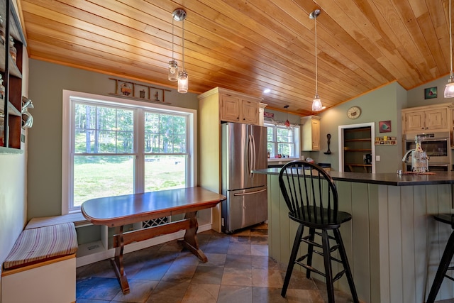 172 Hoxie Hill Rd, Orrington, ME 04474 - kitchen with stainless steel appliances, wood ceiling, dark countertops, a breakfast bar, and vaulted ceiling