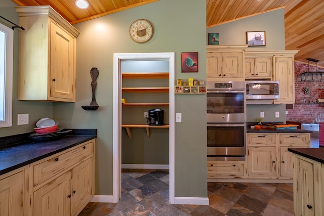172 Hoxie Hill Rd, Orrington, ME 04474 - kitchen featuring stainless steel appliances, wood ceiling, dark countertops, dark stone finish floors, and vaulted ceiling