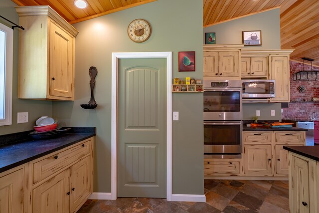 172 Hoxie Hill Rd, Orrington, ME 04474 - kitchen with stainless steel appliances, wooden ceiling, dark countertops, lofted ceiling, and light brown cabinetry
