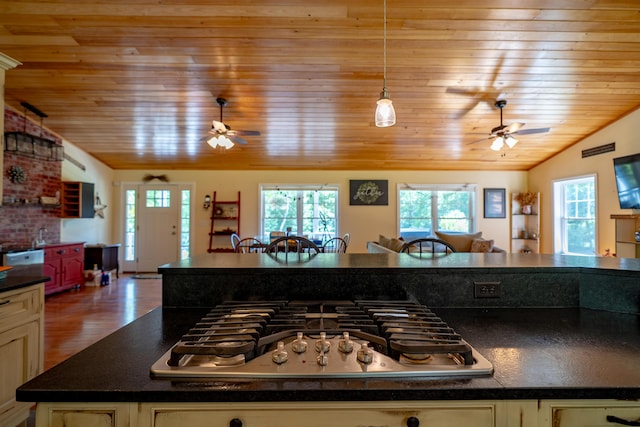 172 Hoxie Hill Rd, Orrington, ME 04474 - kitchen with ceiling fan, stainless steel appliances, vaulted ceiling, dark countertops, and wood ceiling