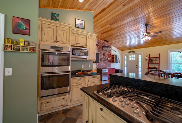 172 Hoxie Hill Rd, Orrington, ME 04474 - kitchen featuring appliances with stainless steel finishes, wood ceiling, dark countertops, cream cabinets, and ceiling fan