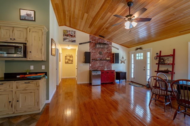 172 Hoxie Hill Rd, Orrington, ME 04474 - kitchen with appliances with stainless steel finishes, cream cabinets, ceiling fan, wood ceiling, and lofted ceiling