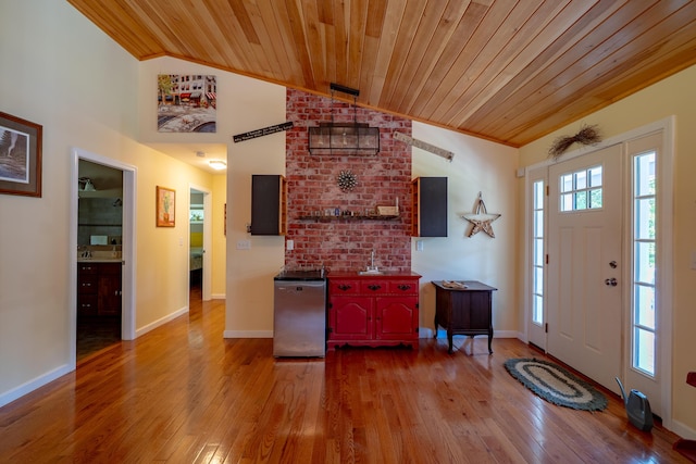 172 Hoxie Hill Rd, Orrington, ME 04474 - entryway featuring wood ceiling, vaulted ceiling, and hardwood / wood-style floors