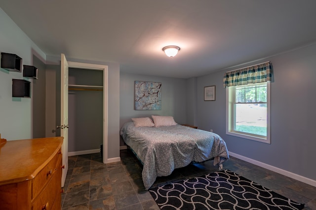 172 Hoxie Hill Rd, Orrington, ME 04474 - bedroom with stone finish floors and a closet