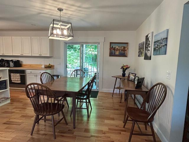 453 Canton Rd, Livermore, ME 04253 - dining space featuring light wood-style floors and baseboards