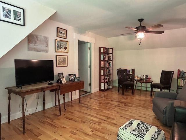 453 Canton Rd, Livermore, ME 04253 - living area with light wood-type flooring, ceiling fan, and baseboards
