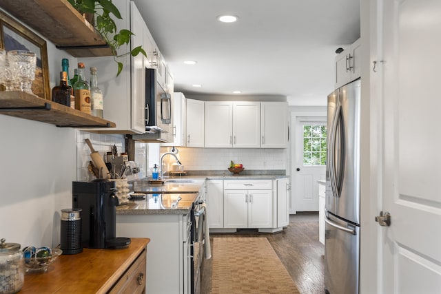 140 New Meadows Rd, West Bath, ME 04530 - kitchen with appliances with stainless steel finishes, dark wood-style flooring, tasteful backsplash, white cabinetry, and recessed lighting