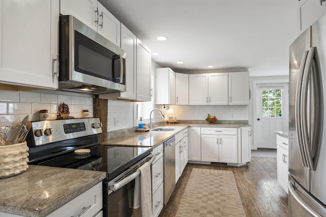 140 New Meadows Rd, West Bath, ME 04530 - kitchen featuring stainless steel appliances, dark wood-style floors, light stone counters, white cabinetry, and recessed lighting