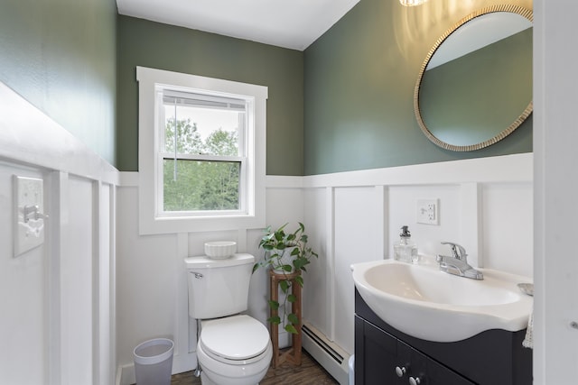 140 New Meadows Rd, West Bath, ME 04530 - bathroom with baseboard heating, vanity, a decorative wall, and a wainscoted wall