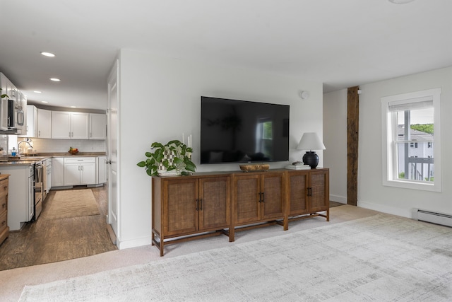 140 New Meadows Rd, West Bath, ME 04530 - living room featuring recessed lighting, light colored carpet, and a baseboard heating unit