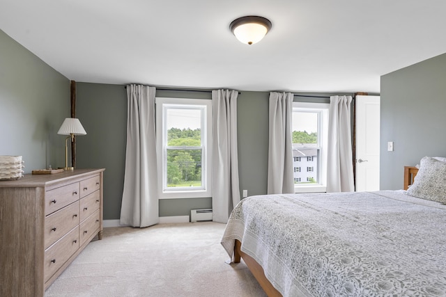 140 New Meadows Rd, West Bath, ME 04530 - bedroom featuring baseboard heating, multiple windows, and light colored carpet