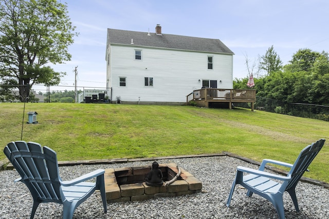 140 New Meadows Rd, West Bath, ME 04530 - back of property featuring an outdoor fire pit, a wooden deck, and a chimney