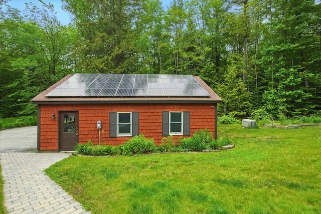 463 Cobbs Bridge Rd, New Gloucester, ME 04260 - view of front facade with solar panels and a front yard