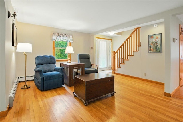 463 Cobbs Bridge Rd, New Gloucester, ME 04260 - living area with light wood-style floors, a baseboard radiator, and stairway