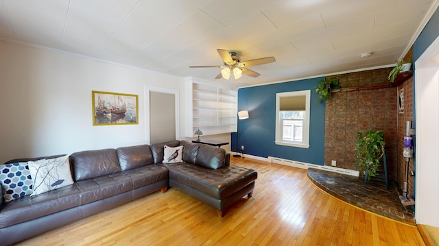 31 Vivian St, Auburn, ME 04210 - living area featuring a baseboard heating unit, wood-type flooring, ceiling fan, crown molding, and built in shelves