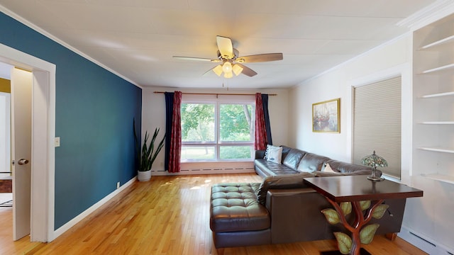 31 Vivian St, Auburn, ME 04210 - living area featuring a baseboard radiator, ornamental molding, a ceiling fan, light wood finished floors, and built in shelves