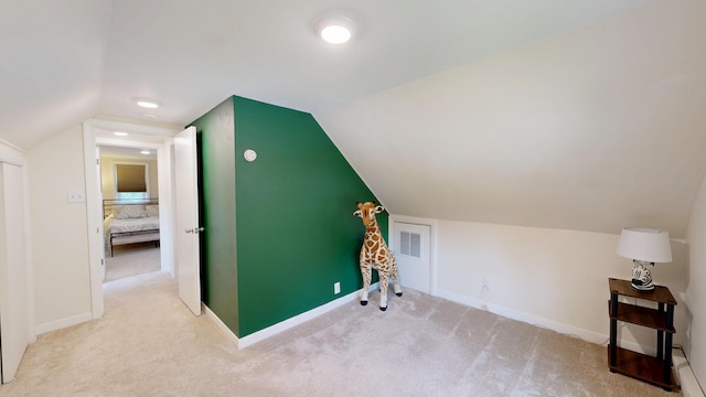 31 Vivian St, Auburn, ME 04210 - additional living space with vaulted ceiling and carpet flooring