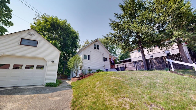 31 Vivian St, Auburn, ME 04210 - view of yard featuring an outbuilding and a garage