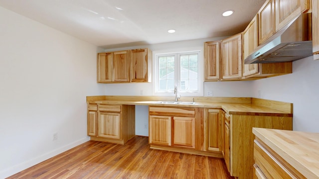 1 Barker St, Jay, ME 04239 - kitchen featuring wood counters, exhaust hood, a sink, light wood-type flooring, and recessed lighting