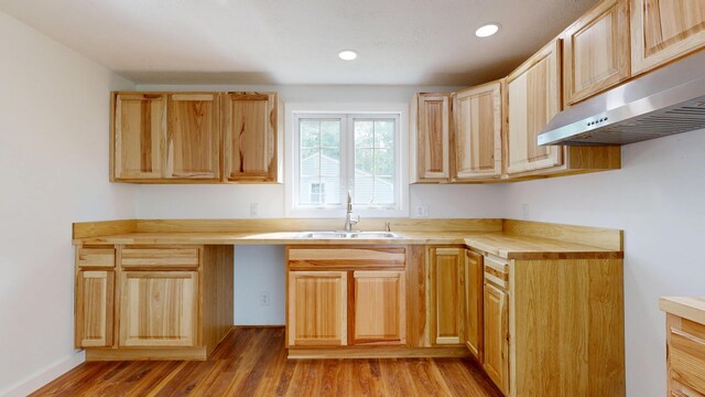 1 Barker St, Jay, ME 04239 - kitchen with a sink, range hood, light wood-style flooring, recessed lighting, and light brown cabinetry
