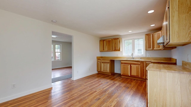 1 Barker St, Jay, ME 04239 - kitchen with a sink, light countertops, light wood-type flooring, baseboards, and recessed lighting