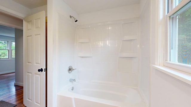 1 Barker St, Jay, ME 04239 - full bathroom with washtub / shower combination and wood finished floors