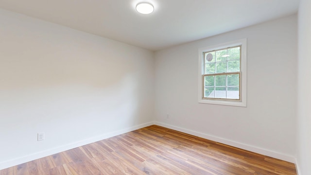 1 Barker St, Jay, ME 04239 - empty room with baseboards and light wood finished floors