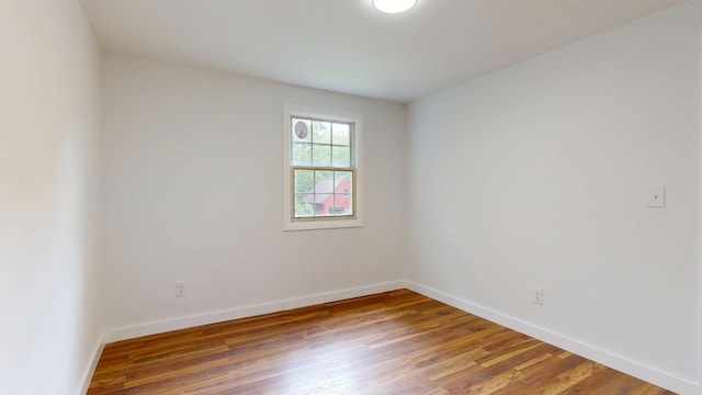1 Barker St, Jay, ME 04239 - empty room featuring wood finished floors and baseboards