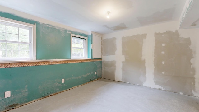 1 Barker St, Jay, ME 04239 - empty room with concrete floors