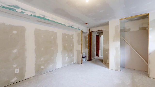 1 Barker St, Jay, ME 04239 - unfurnished bedroom featuring concrete floors