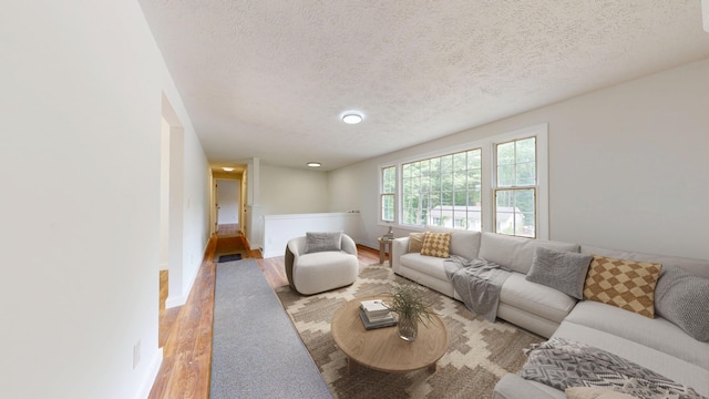 1 Barker St, Jay, ME 04239 - living area with wood finished floors and a textured ceiling