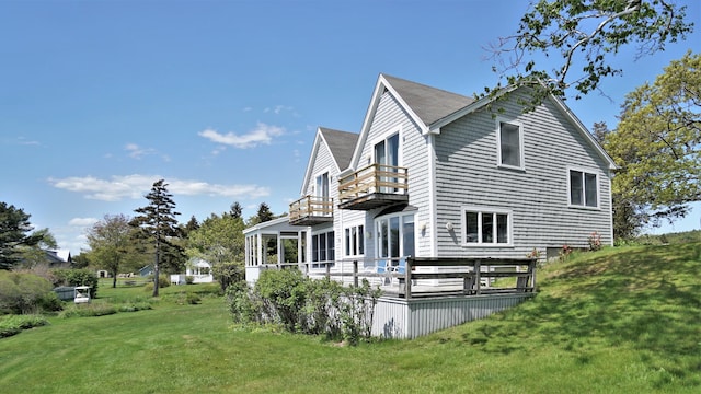 65 Shell Rd, Phippsburg, ME 04562 - view of home's exterior with a balcony and a yard