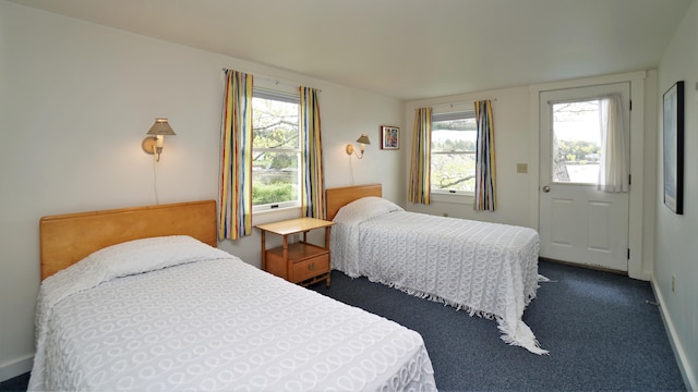 65 Shell Rd, Phippsburg, ME 04562 - bedroom with multiple windows and dark colored carpet