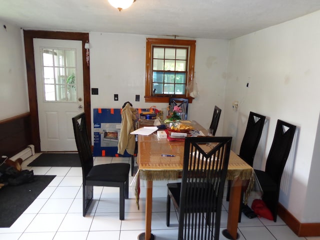 27 Grove St, Sanford, ME 04083 - dining area featuring light tile patterned flooring and a baseboard radiator