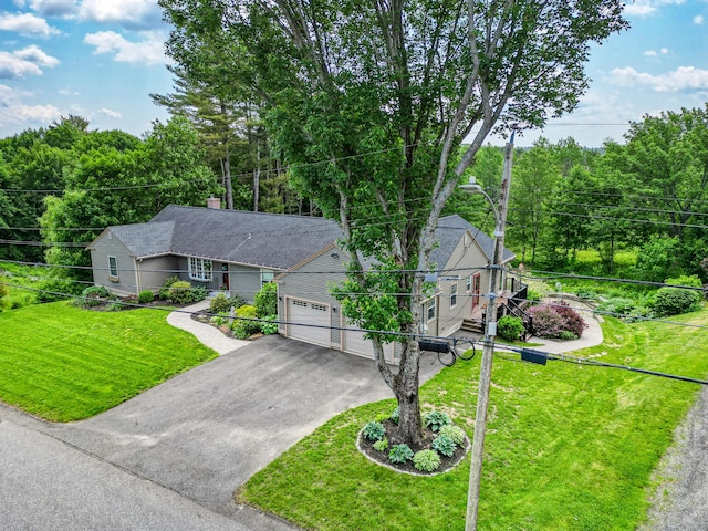4 Mayflower Rd, Hallowell, ME 04347 - ranch-style house featuring asphalt driveway, a front lawn, and an attached garage