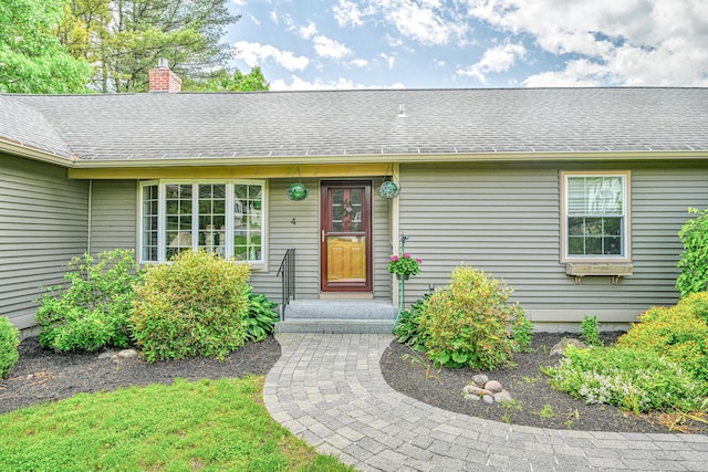 4 Mayflower Rd, Hallowell, ME 04347 - entrance to property with a chimney and roof with shingles