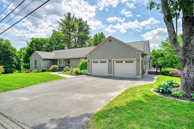 4 Mayflower Rd, Hallowell, ME 04347 - ranch-style home featuring a garage, driveway, a front lawn, and a chimney