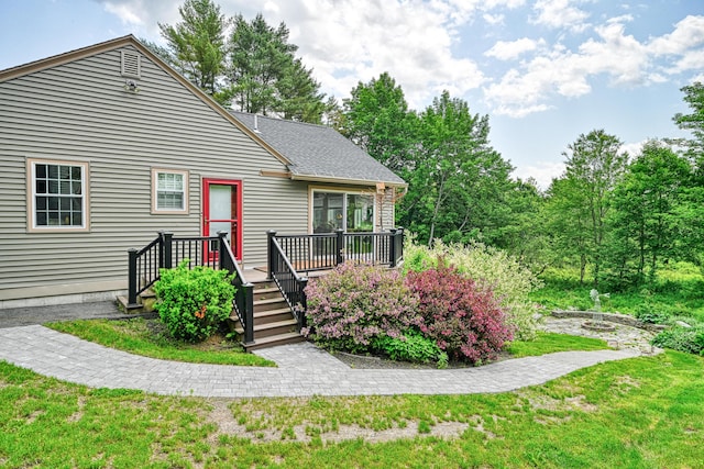 4 Mayflower Rd, Hallowell, ME 04347 - view of front facade featuring a wooden deck and a front yard