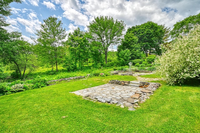 4 Mayflower Rd, Hallowell, ME 04347 - view of grassy yard with a patio area and a fire pit