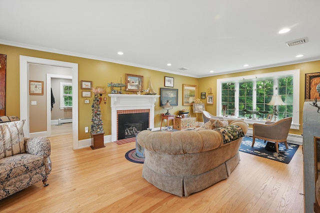 4 Mayflower Rd, Hallowell, ME 04347 - living area featuring a brick fireplace, light wood finished floors, baseboard heating, crown molding, and recessed lighting