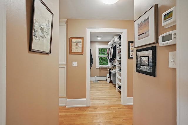 4 Mayflower Rd, Hallowell, ME 04347 - corridor with light wood-type flooring and a baseboard heating unit
