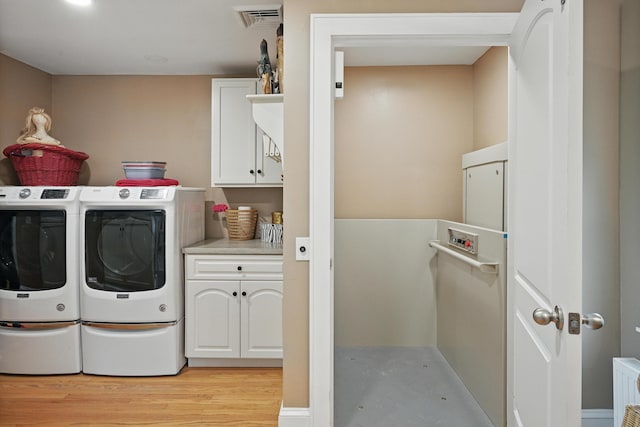 4 Mayflower Rd, Hallowell, ME 04347 - laundry area with washing machine and clothes dryer, cabinet space, and light wood-style flooring