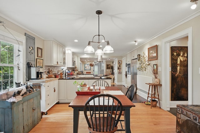 4 Mayflower Rd, Hallowell, ME 04347 - dining room with crown molding, light wood-type flooring, a chandelier, and recessed lighting