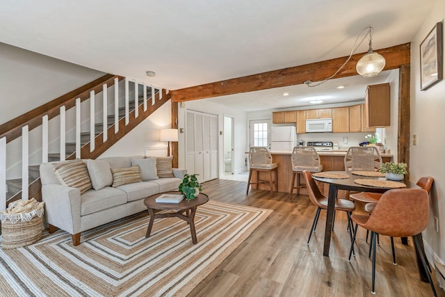 3 Ocean Breeze Unit 2, York, ME 03909 - living room featuring light wood finished floors, stairway, beamed ceiling, baseboards, and recessed lighting