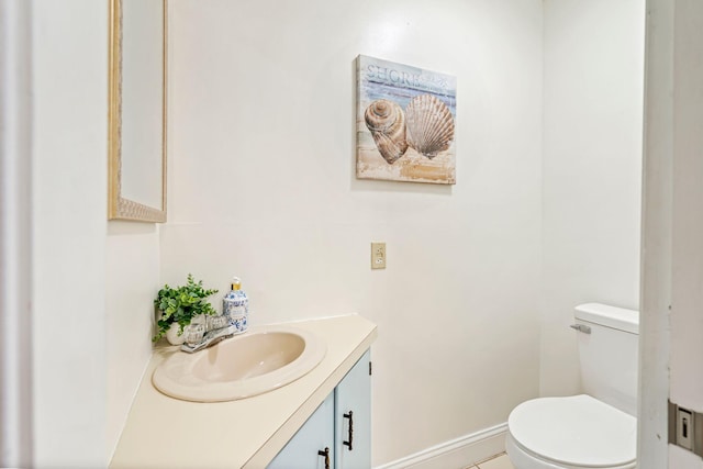 3 Ocean Breeze Unit 2, York, ME 03909 - bathroom with vanity, toilet, tile patterned floors, and baseboards
