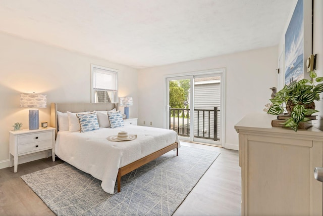 3 Ocean Breeze Unit 2, York, ME 03909 - bedroom featuring access to exterior, multiple windows, light wood-type flooring, and baseboards